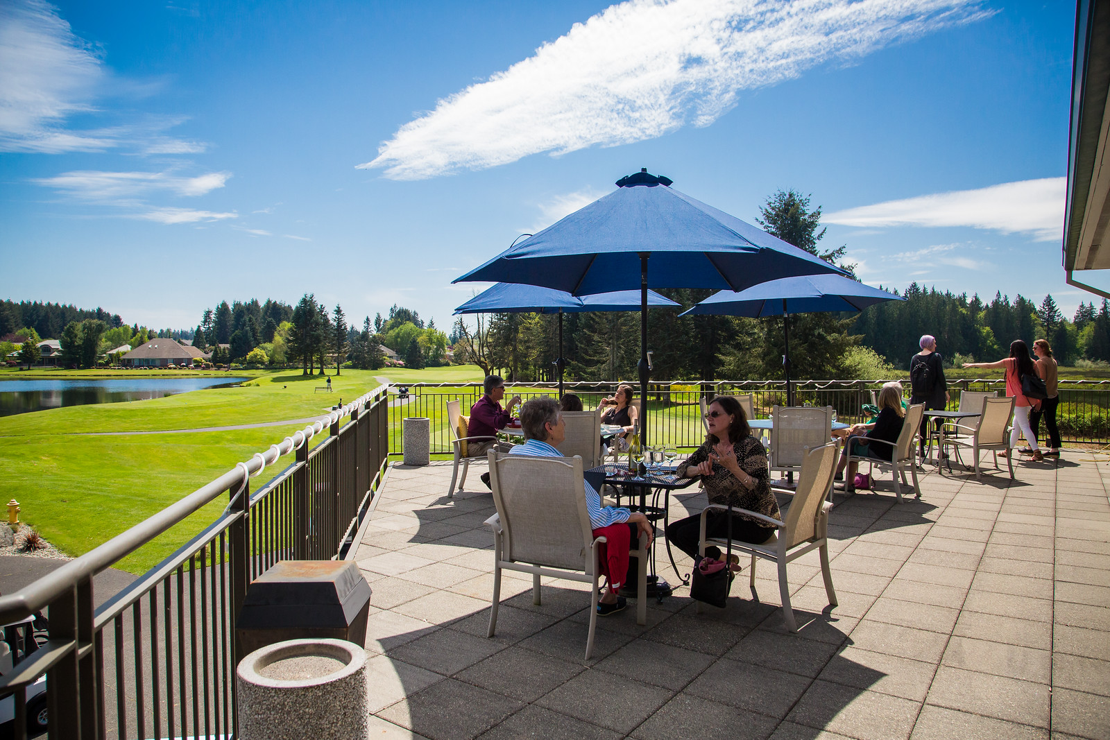 Members enjoying a meal on the patio at Embers Restaurant at Indian Summer G&CC.